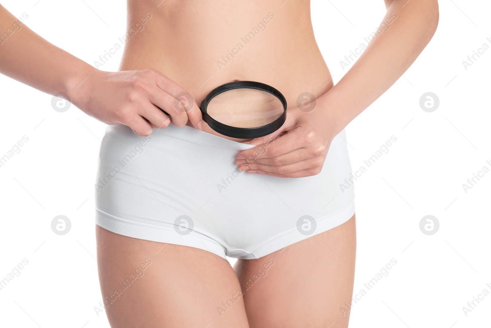 Photo of Young woman with magnifying glass near underwear on white background. Gynecology