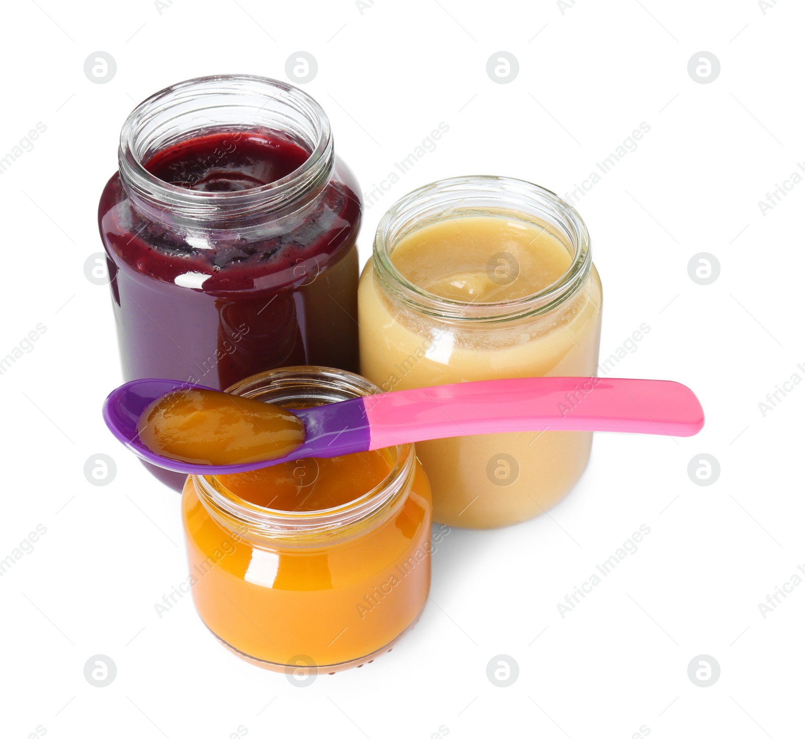 Photo of Tasty baby food in jars and spoon isolated on white