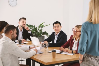 Businesspeople having meeting at table in office