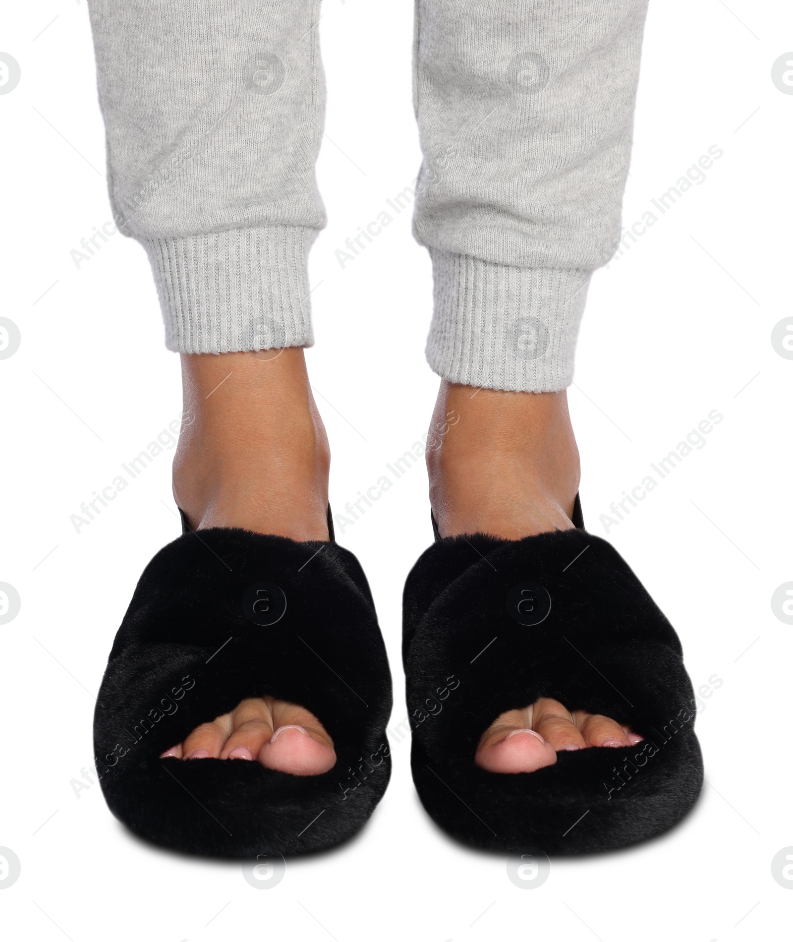 Photo of Woman in fluffy slippers on white background, closeup