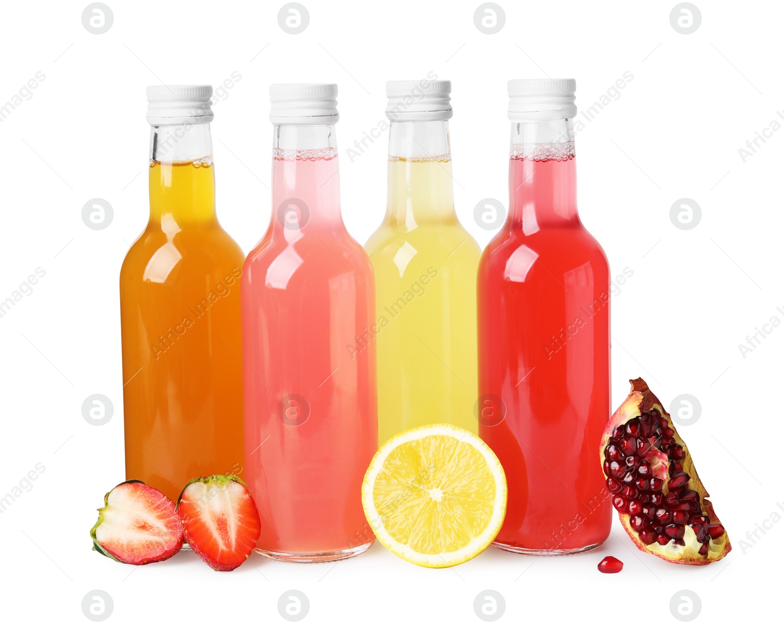 Photo of Delicious kombucha in glass bottles and fresh fruits isolated on white