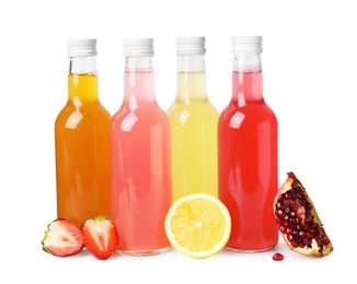 Photo of Delicious kombucha in glass bottles and fresh fruits isolated on white