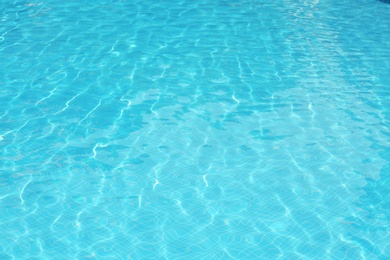 Photo of Clear refreshing water in swimming pool, closeup