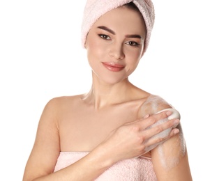 Photo of Young woman washing body with soap bar on white background