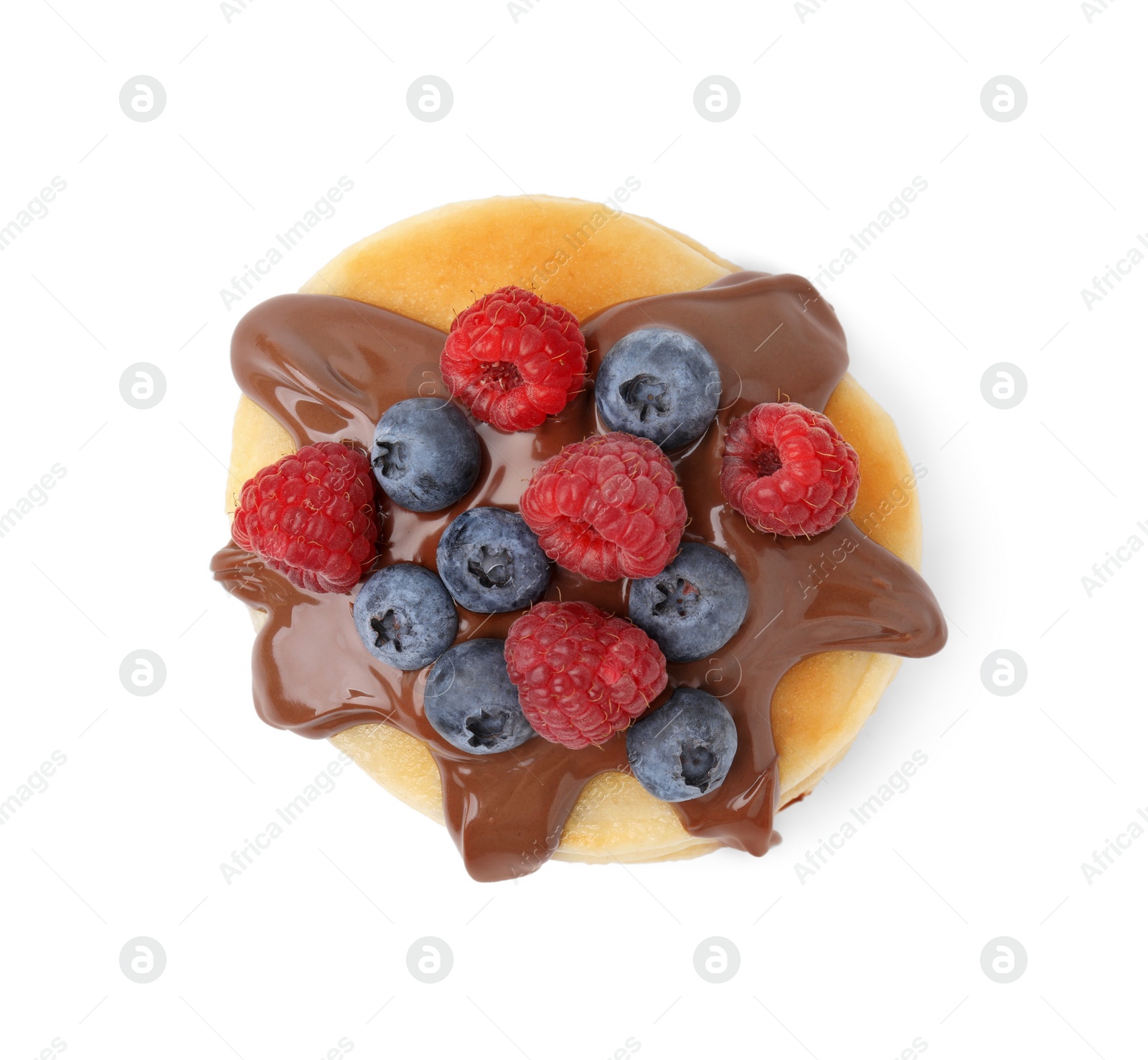 Photo of Tasty pancake with chocolate spread and berries isolated on white, top view
