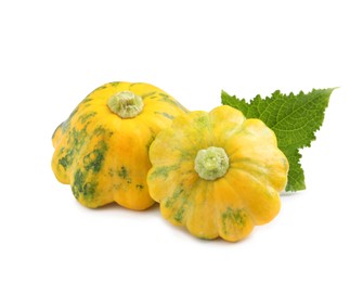 Photo of Fresh ripe pattypan squashes with leaf on white background