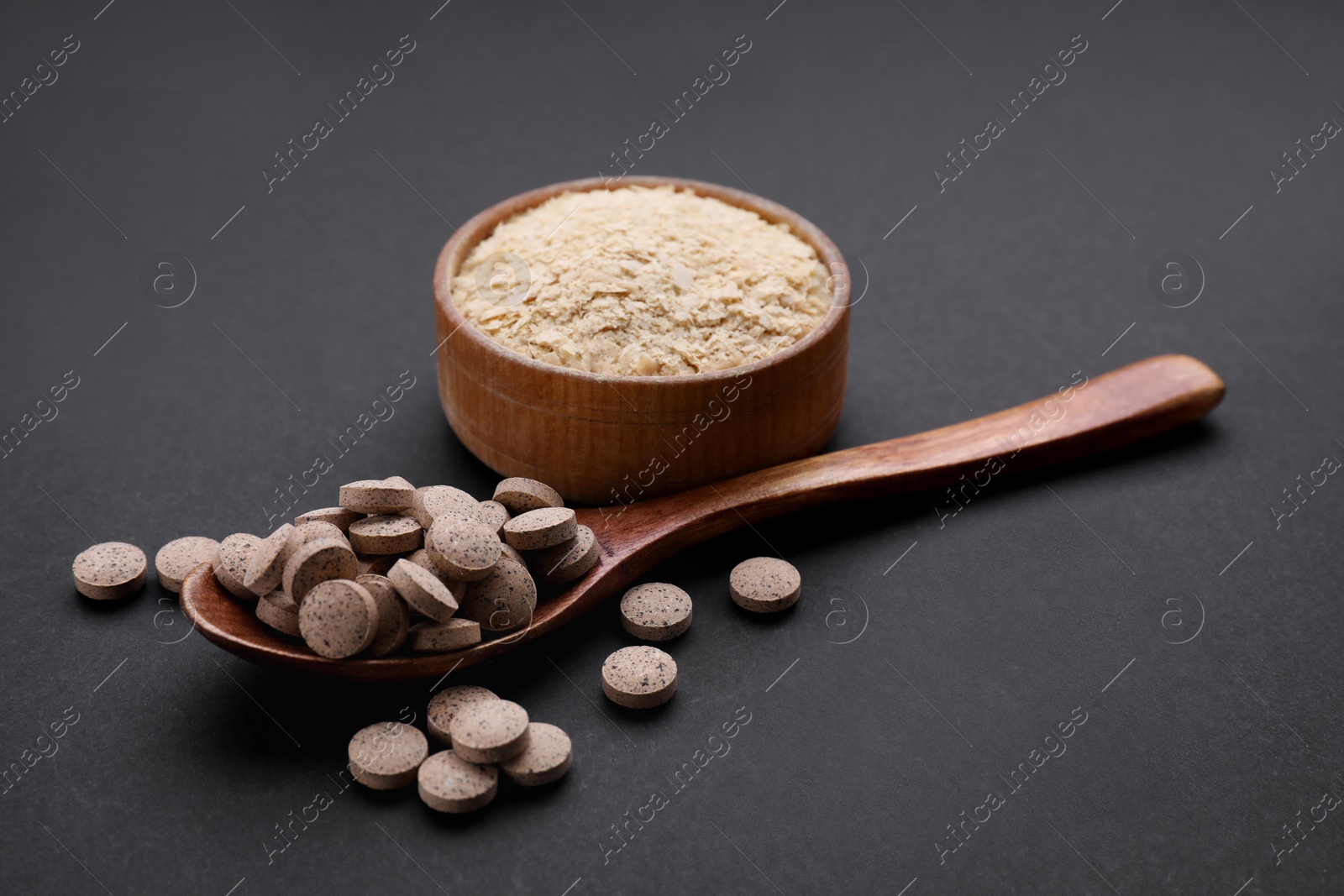 Photo of Different types of brewer`s yeast on black background