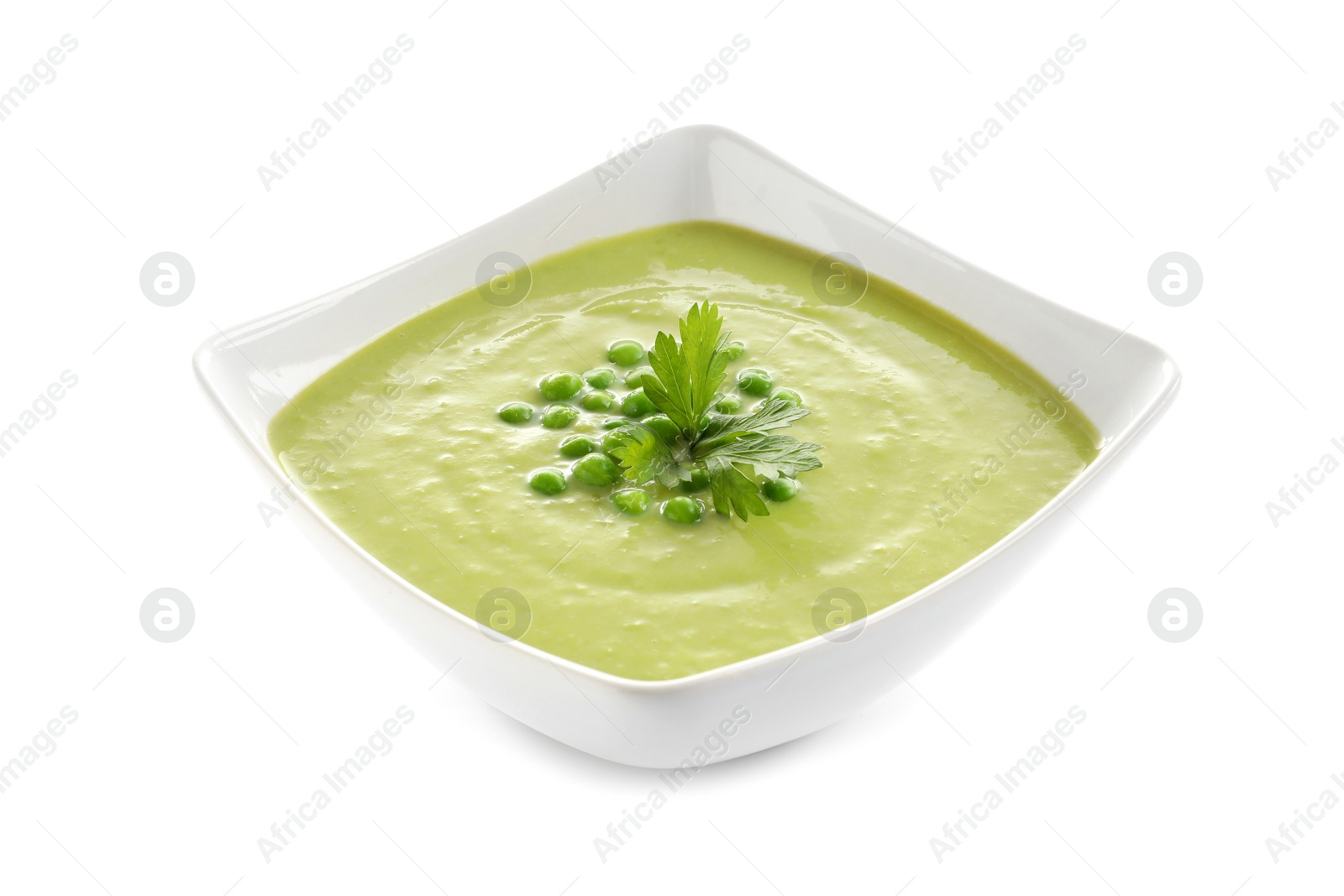 Photo of Fresh vegetable detox soup made of green peas in dish on white background