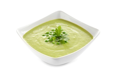 Photo of Fresh vegetable detox soup made of green peas in dish on white background