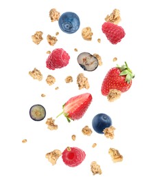 Image of Delicious granola and berries falling on white background. Healthy snack  