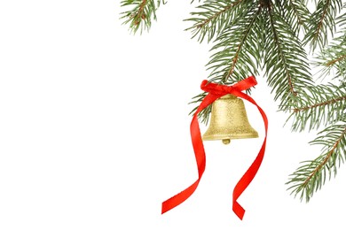 Photo of Christmas bell with red bow hanging on fir tree branch against white background