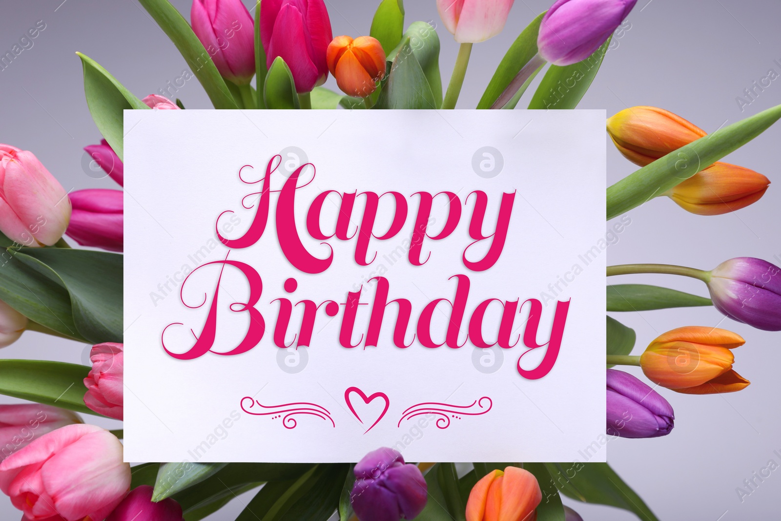 Image of Beautiful bouquet of tulip flowers with Happy Birthday card on light background, top view