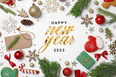 Image of Happy New 2023 Year! Frame made with festive decor on white background, top view 