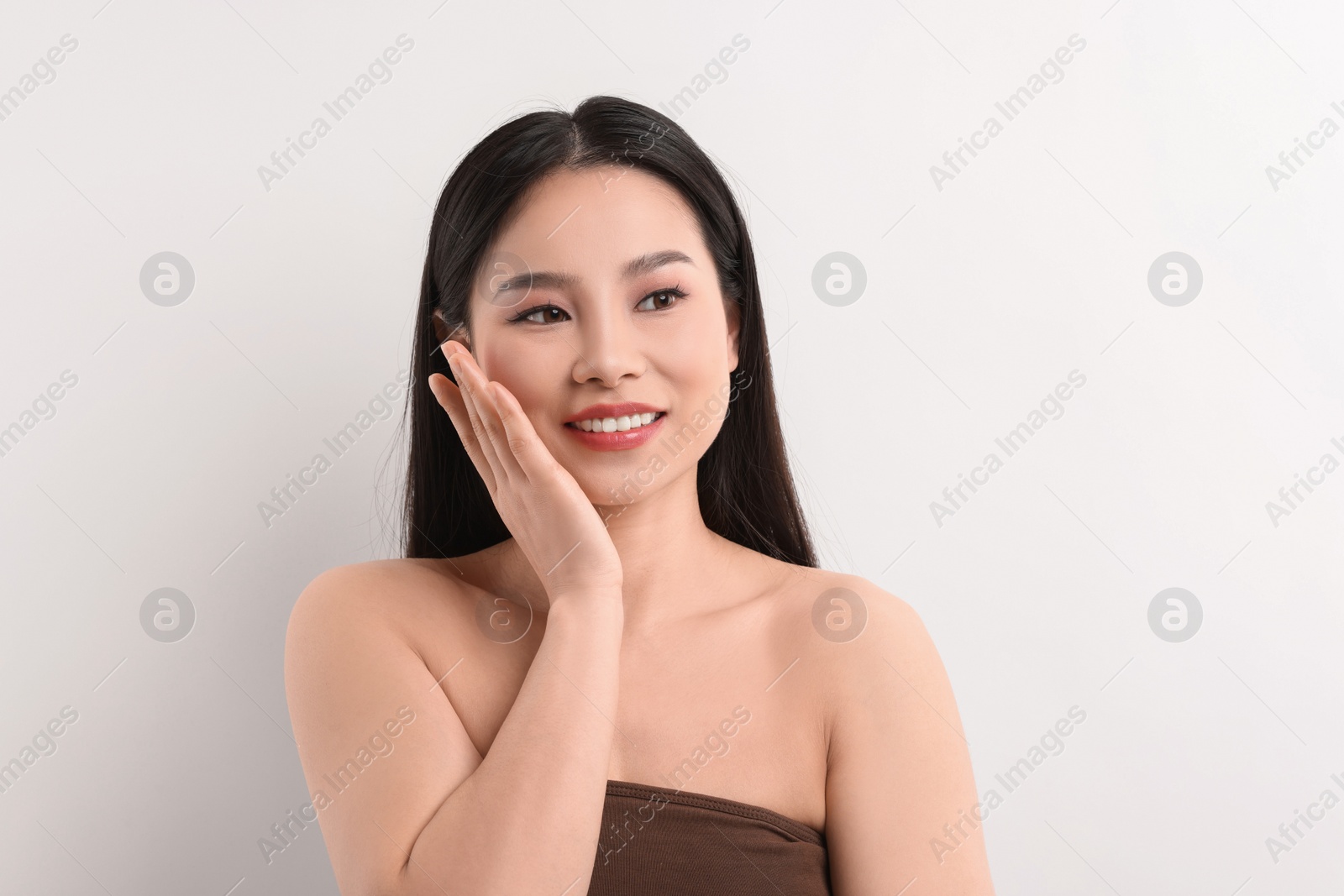 Photo of Portrait of beautiful woman on white background