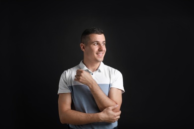 Portrait of handsome man on black background