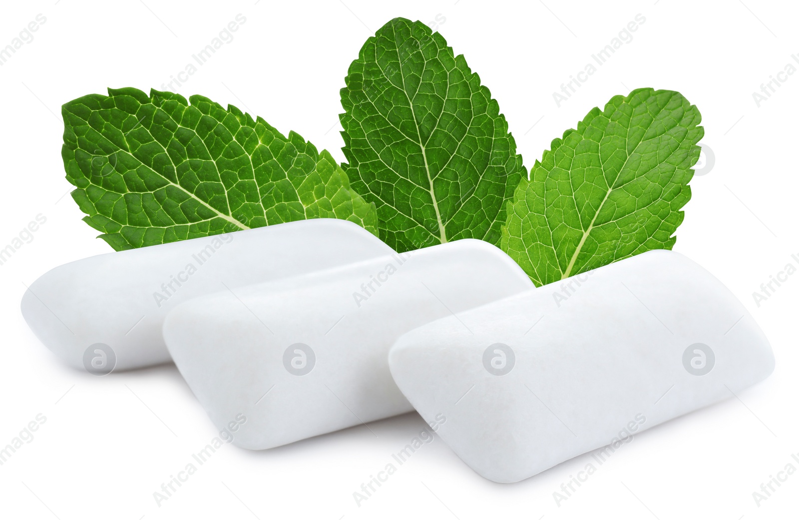 Image of Menthol chewing gum pillows and mint leaves on white background