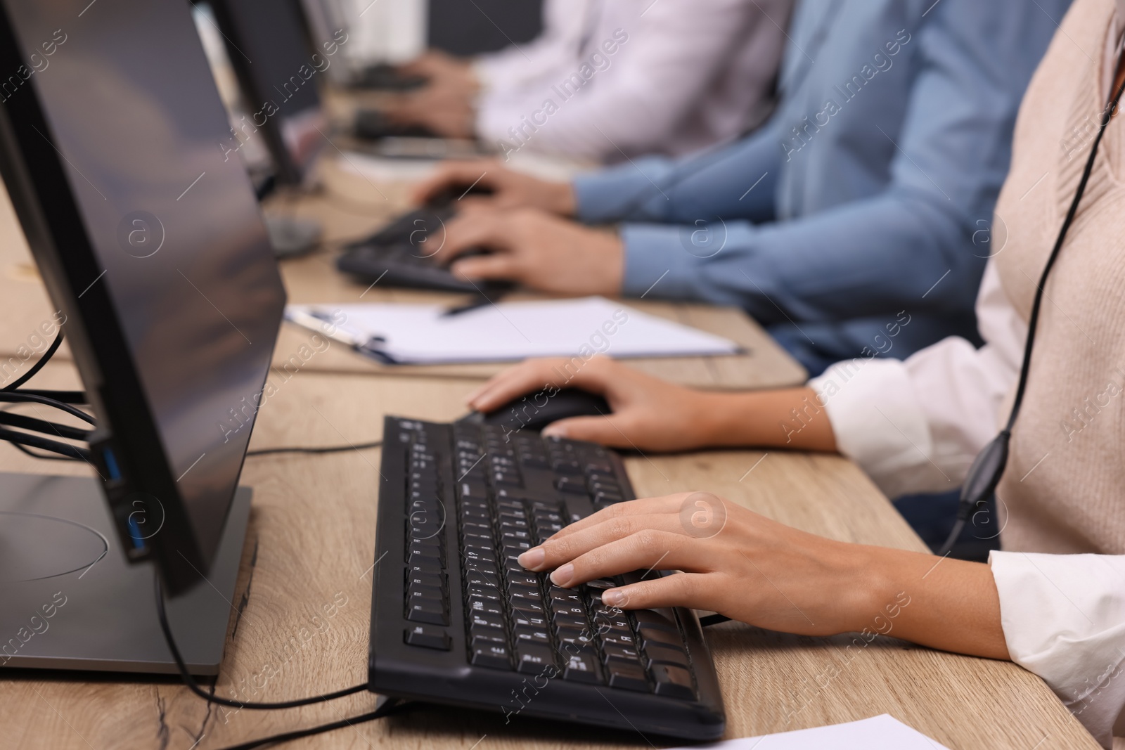 Photo of Call center operators working in office, closeup