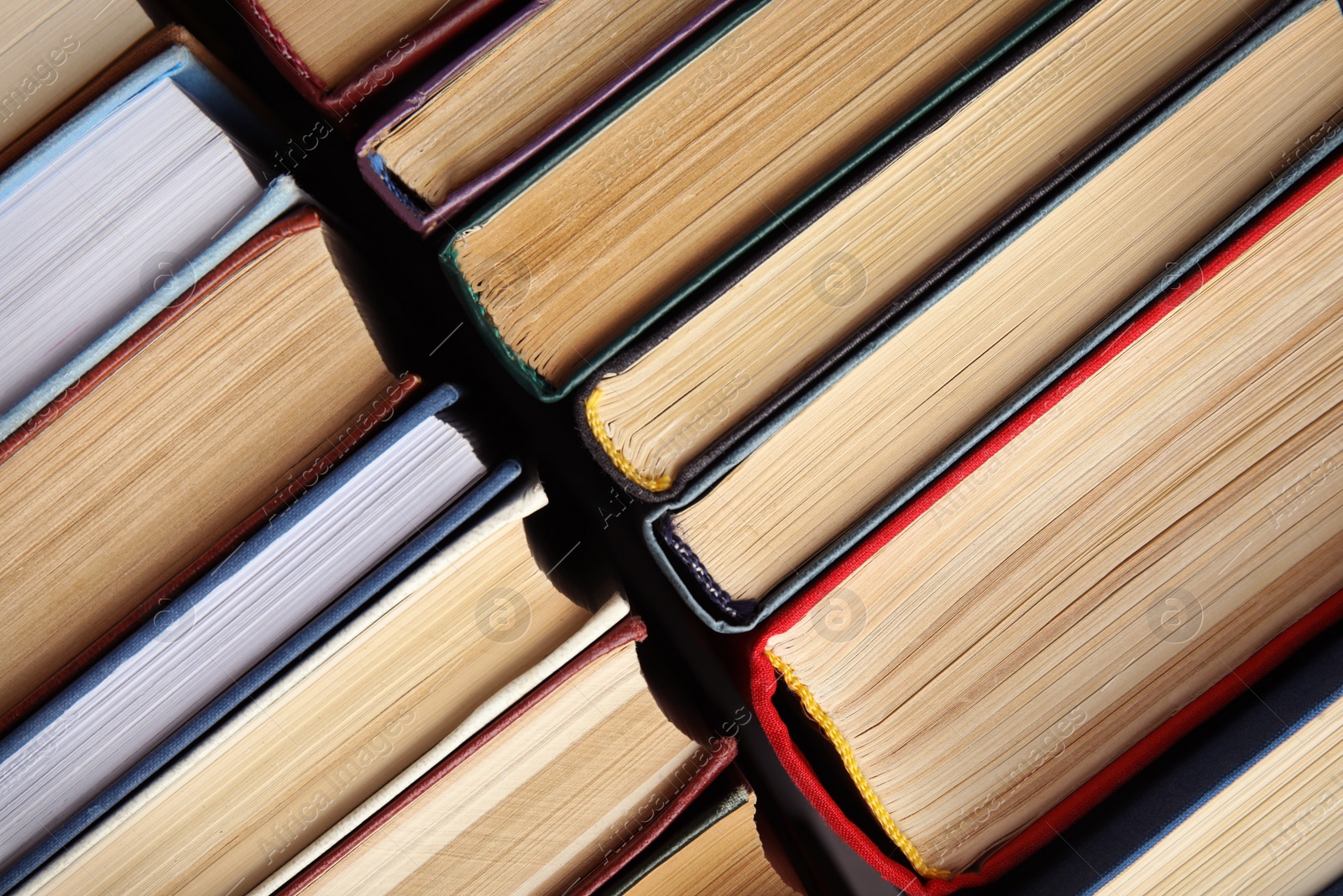 Photo of Many different hardcover books as background, top view