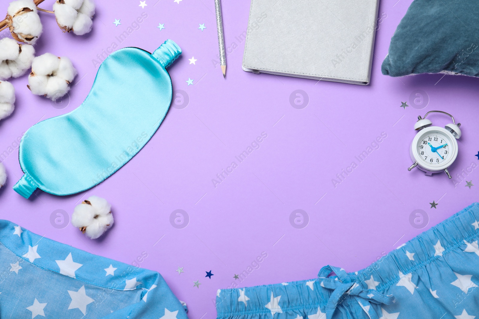 Photo of Flat lay composition with sleeping mask on violet background, space for text. Bedtime accessories