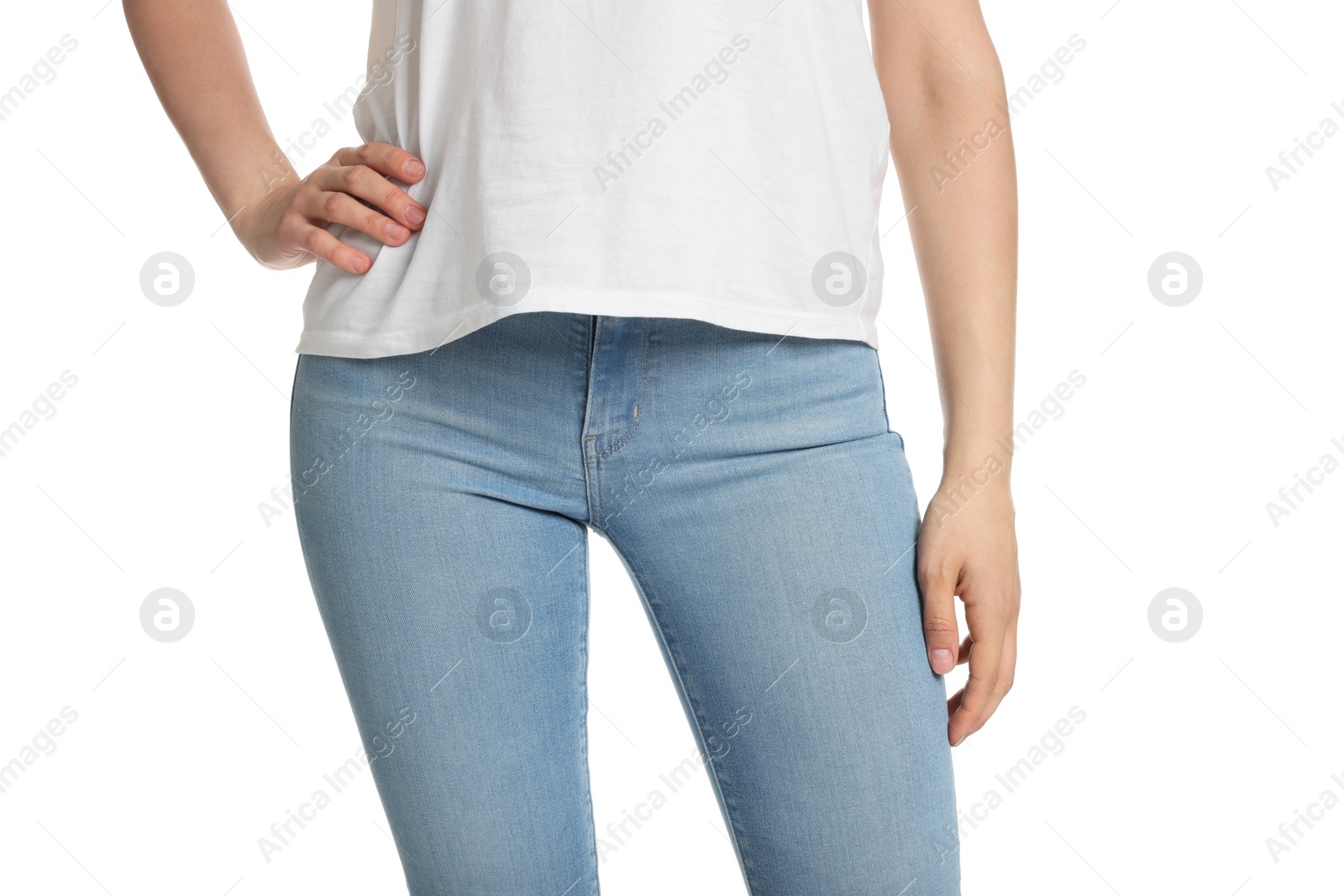 Photo of Woman wearing stylish light blue jeans on white background, closeup