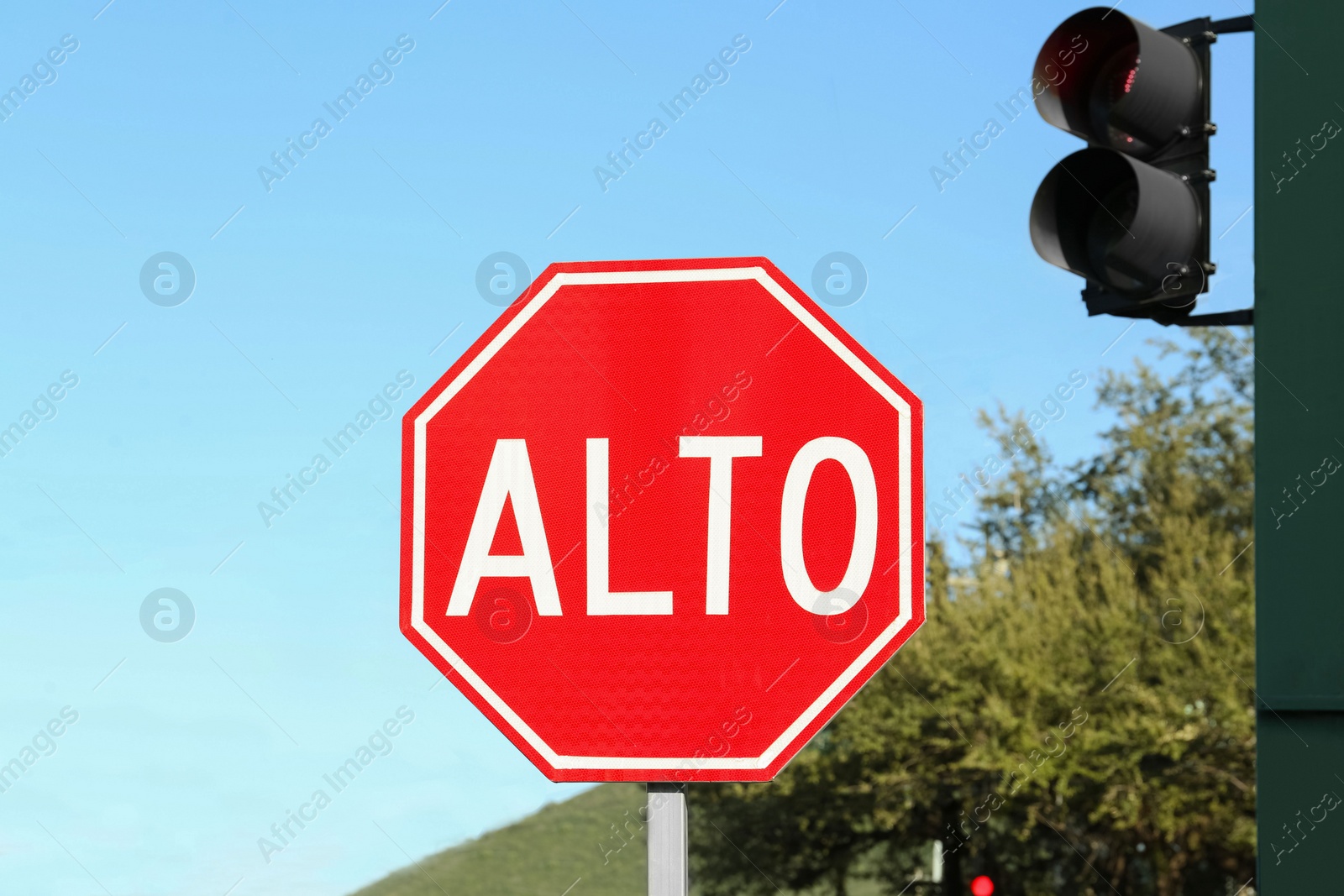 Photo of Red Stop warning road sign in Mexico on city street