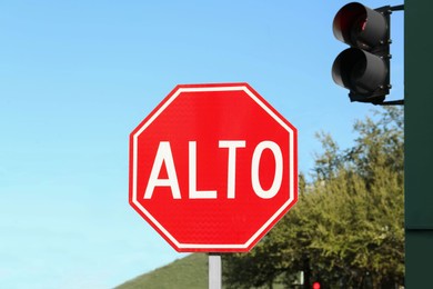 Photo of Red Stop warning road sign in Mexico on city street