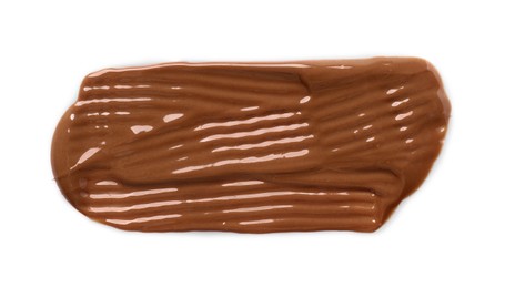 Smear of tasty milk chocolate paste isolated on white, top view