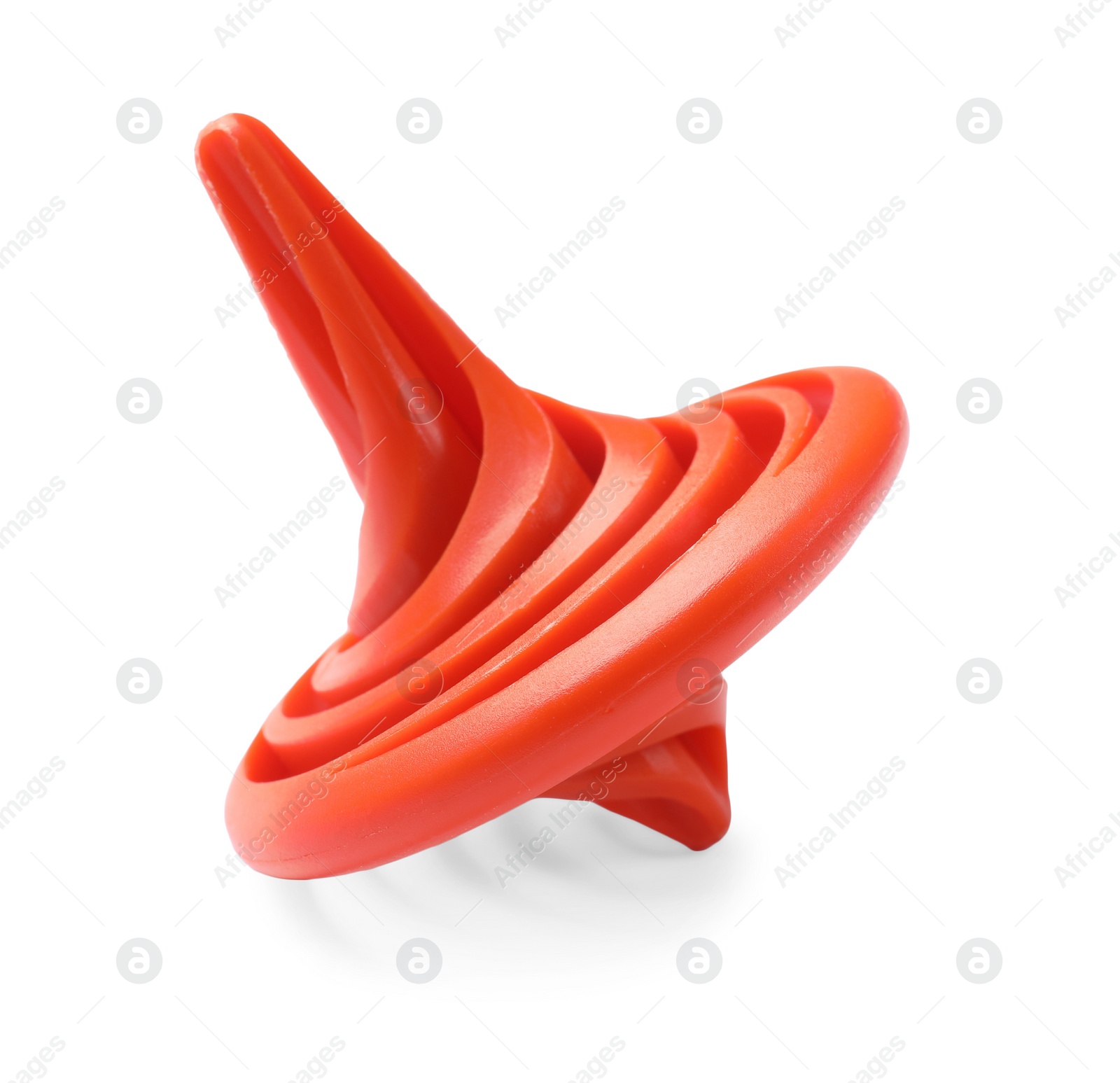 Photo of One orange spinning top on white background