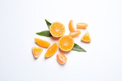 Photo of Composition with fresh ripe tangerines and leaves on white background, flat lay. Citrus fruit