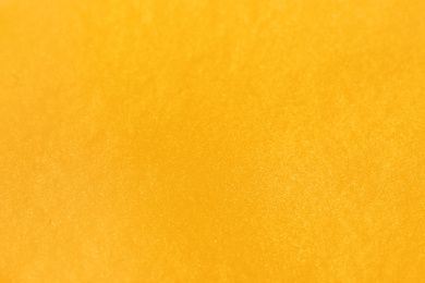 Closeup view of yellow slime as background. Antistress toy