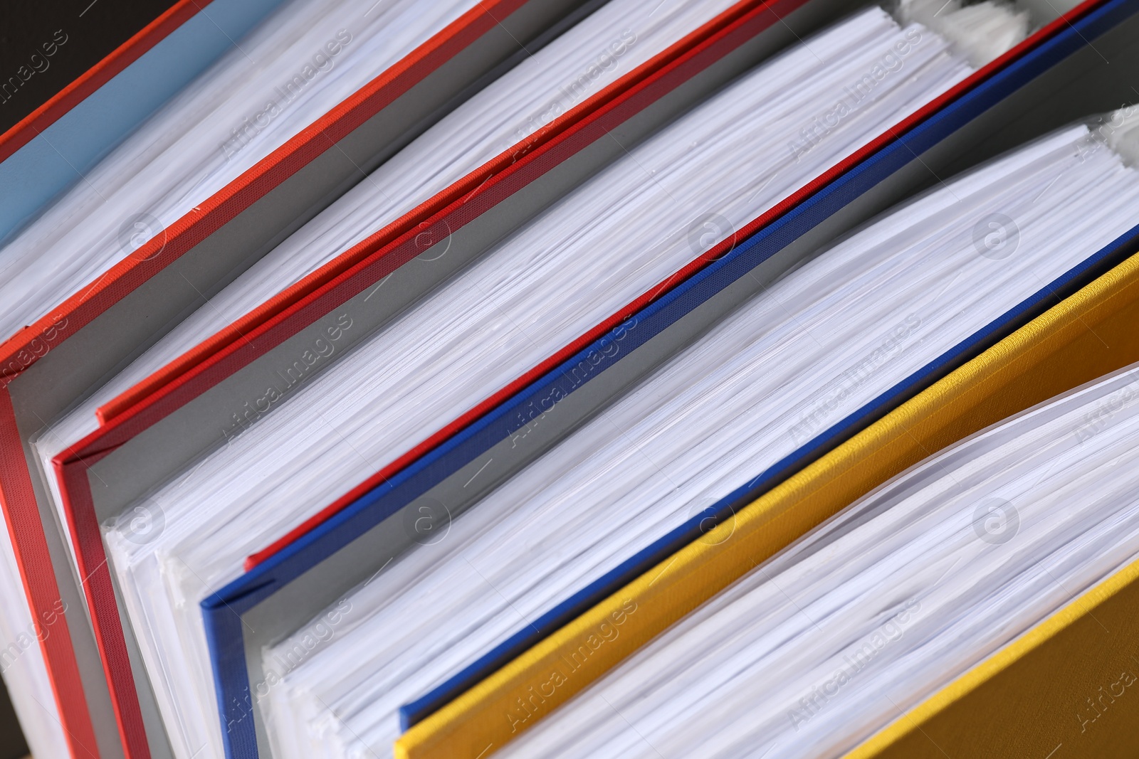 Photo of Colorful binder office folders as background, closeup