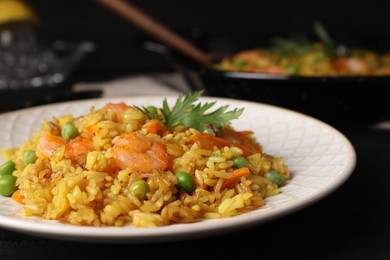 Photo of Tasty rice with shrimps and vegetables on table, closeup
