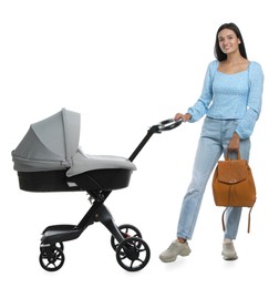 Happy young woman with baby stroller on white background