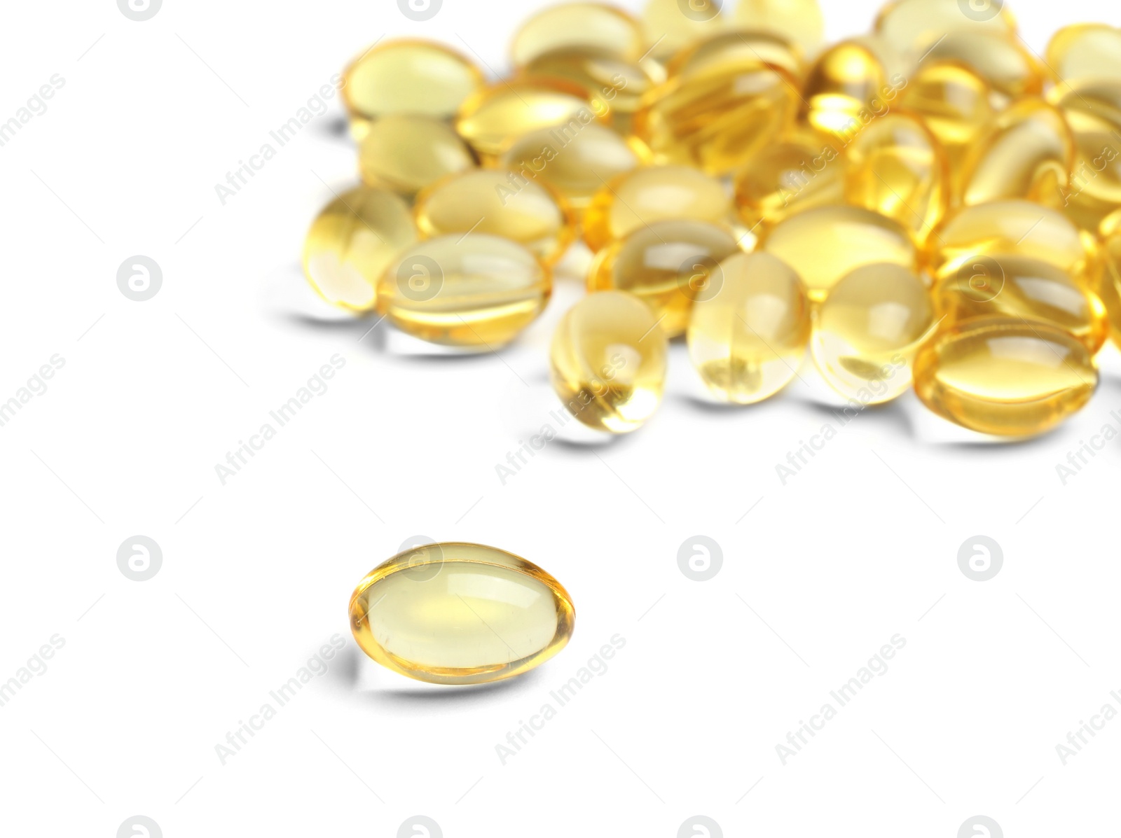 Photo of Cod liver oil pills on white background