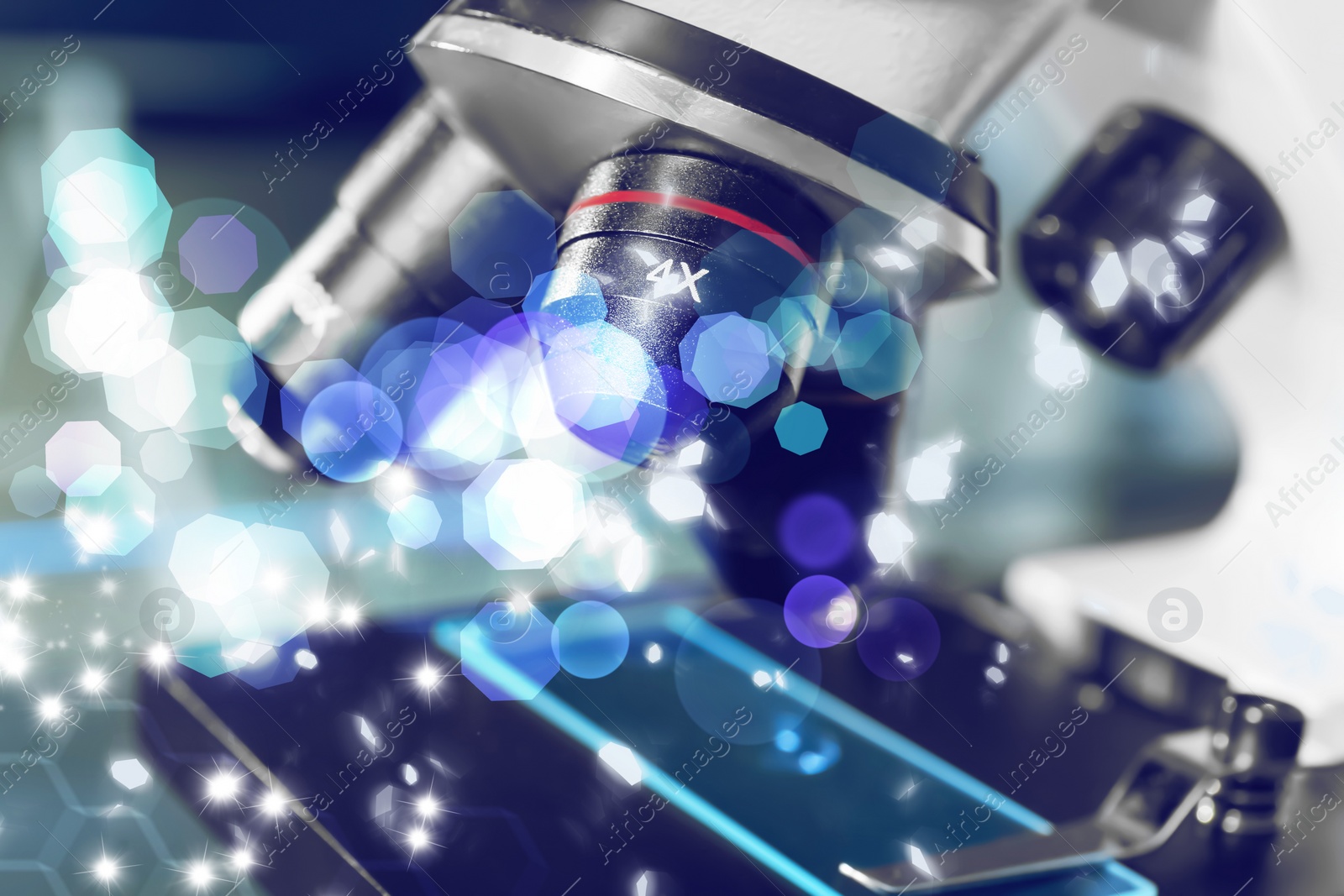 Image of Microscope with glass slide, closeup. Laboratory equipment. Bokeh effect