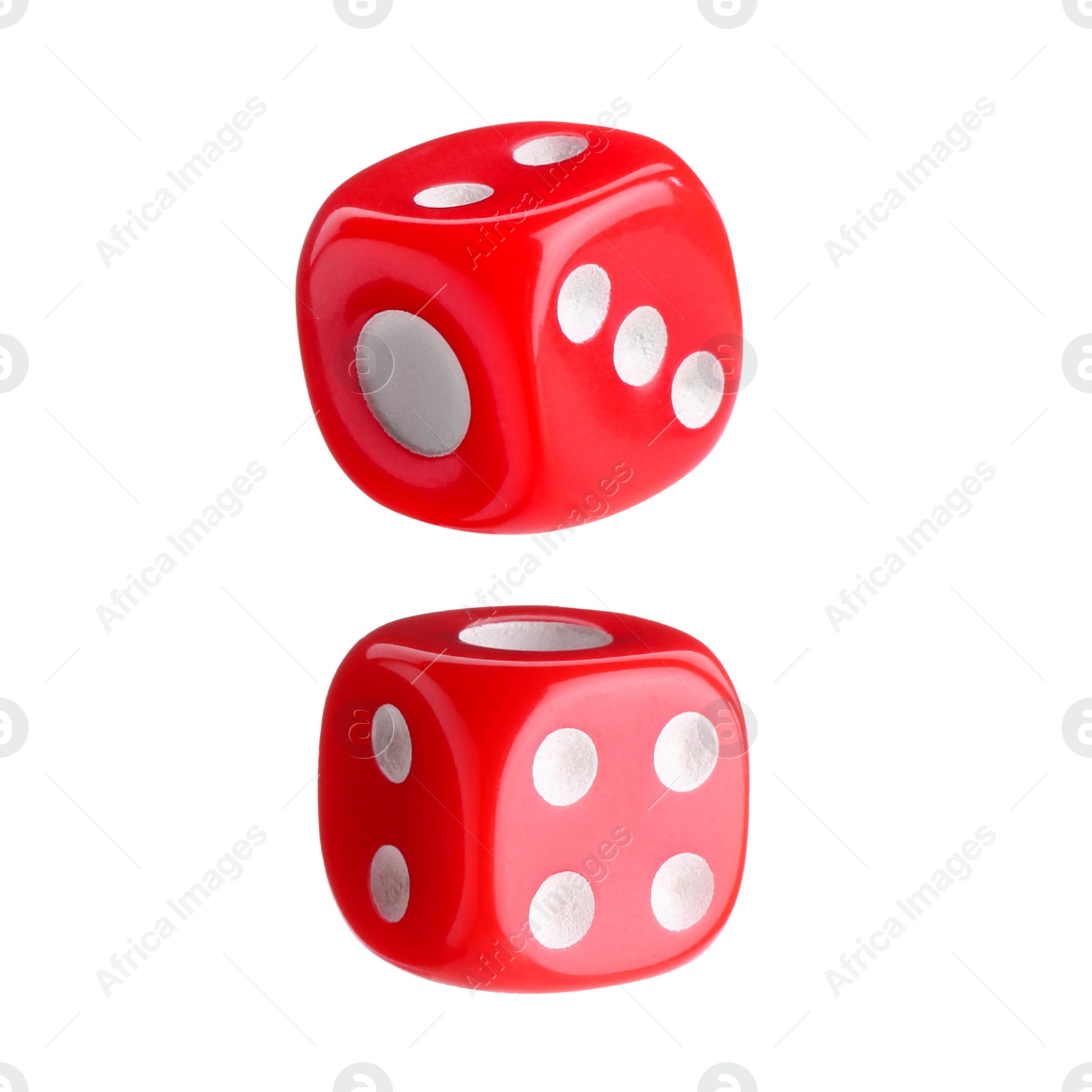 Image of Two red dice in air on white background