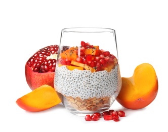 Glass of tasty chia seed pudding and fruits on white background