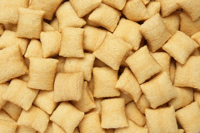 Photo of Sweet crispy corn pads as background, top view