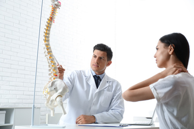 Young woman visiting orthopedist in medical office