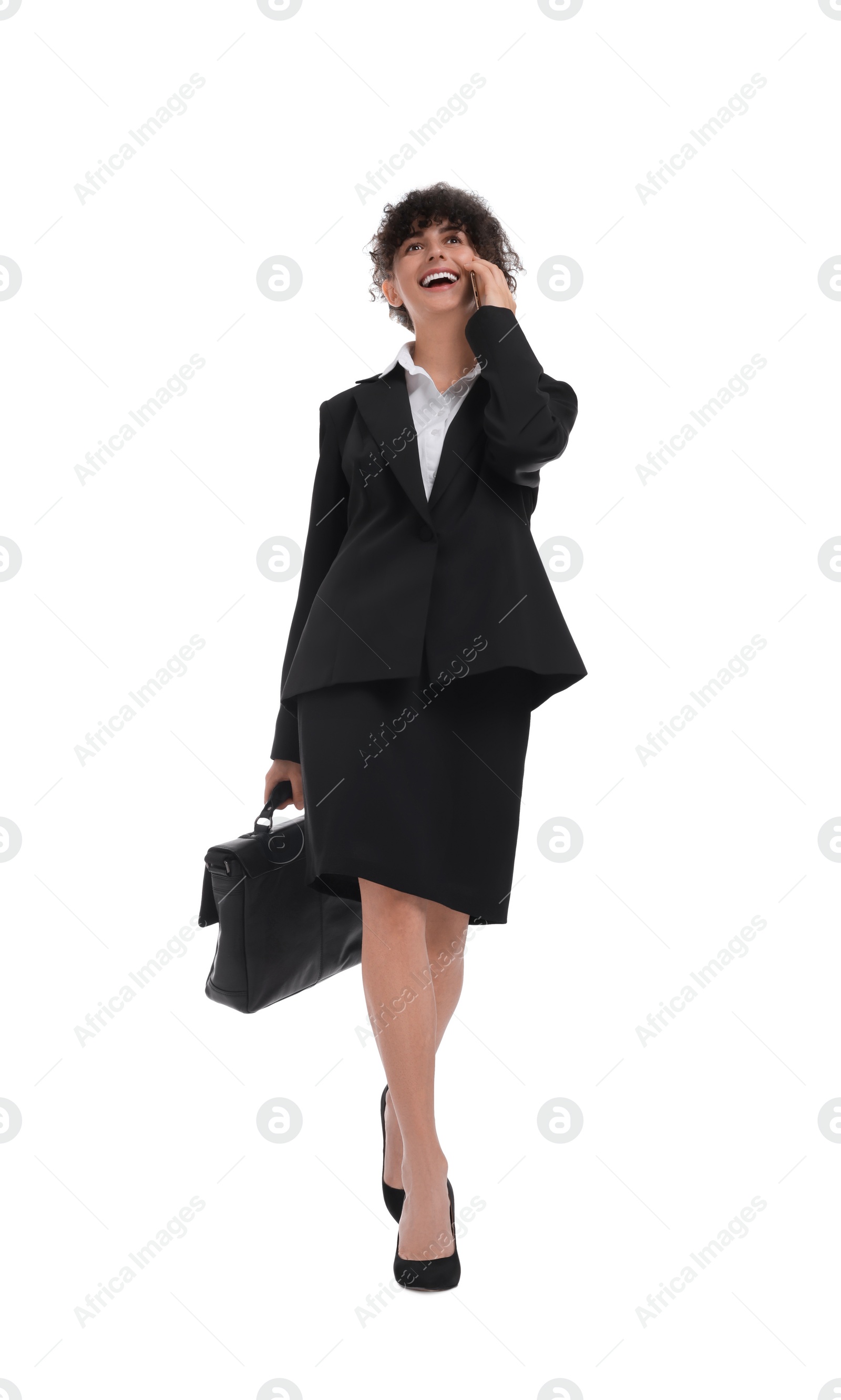 Photo of Beautiful businesswoman with briefcase talking on smartphone against white background