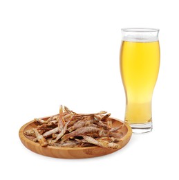 Photo of Tasty dried anchovies and glass of beer on white background