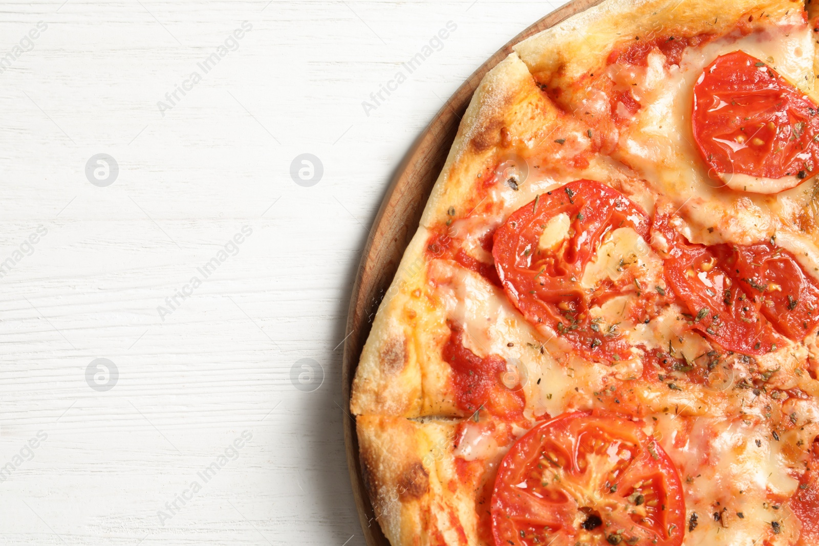 Photo of Hot cheese pizza Margherita on white wooden background, top view. Space for text