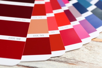 Photo of Color palette samples on table, closeup