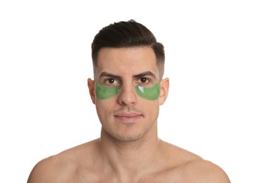 Photo of Man with green under eye patches on white background