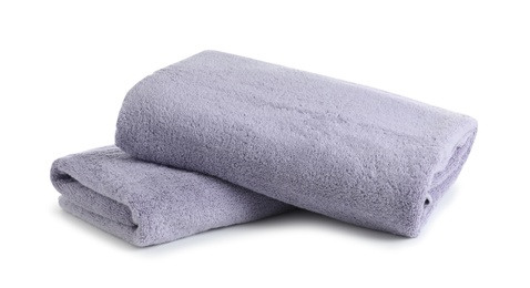 Photo of Fresh soft folded towels isolated on white