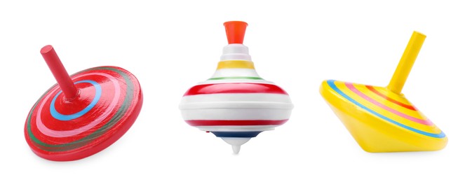 Different spinning tops isolated on white. Toy whirligig