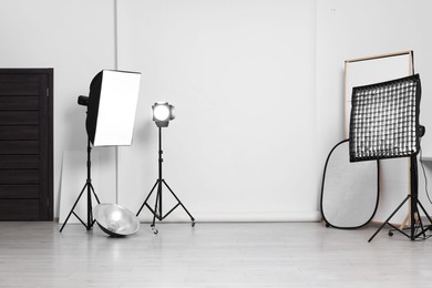 Photo of White photo background and professional lighting equipment in studio
