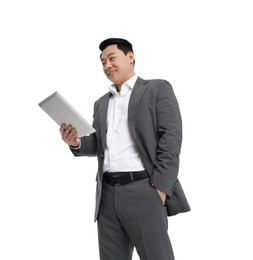 Photo of Businessman in suit with tablet on white background, low angle view