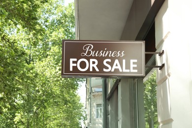 Building with sign Business For Sale outdoors