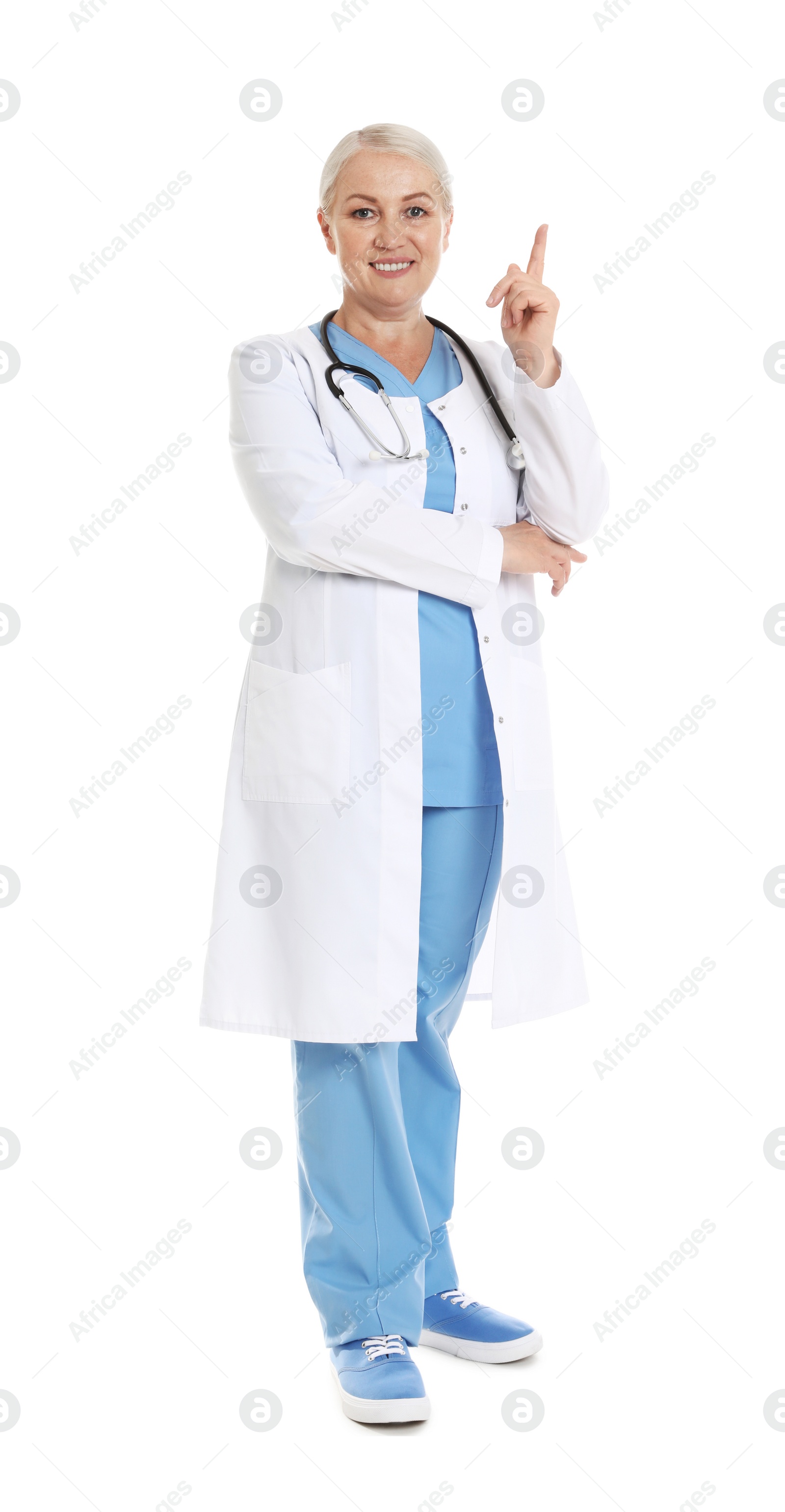 Photo of Full length portrait of female doctor isolated on white. Medical staff